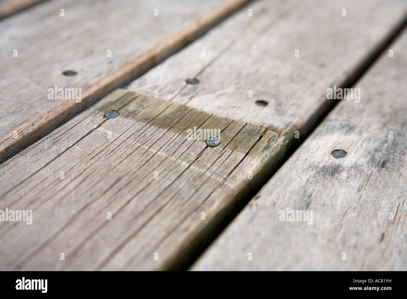 nails in weathered wood deck Stock Photo Alamy