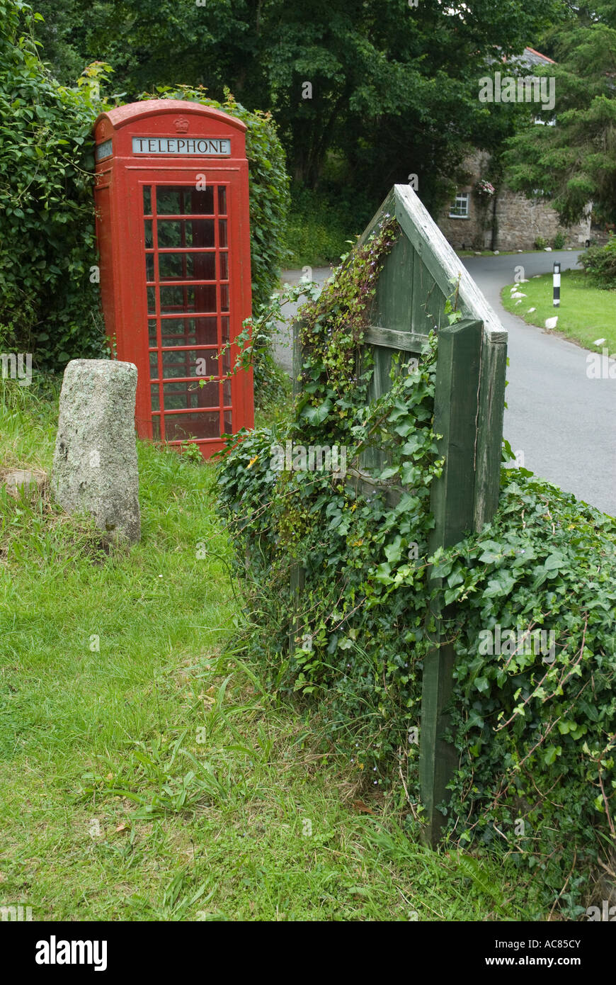 Traditional Red Telephone Box in Cornwall Village Stock Photo