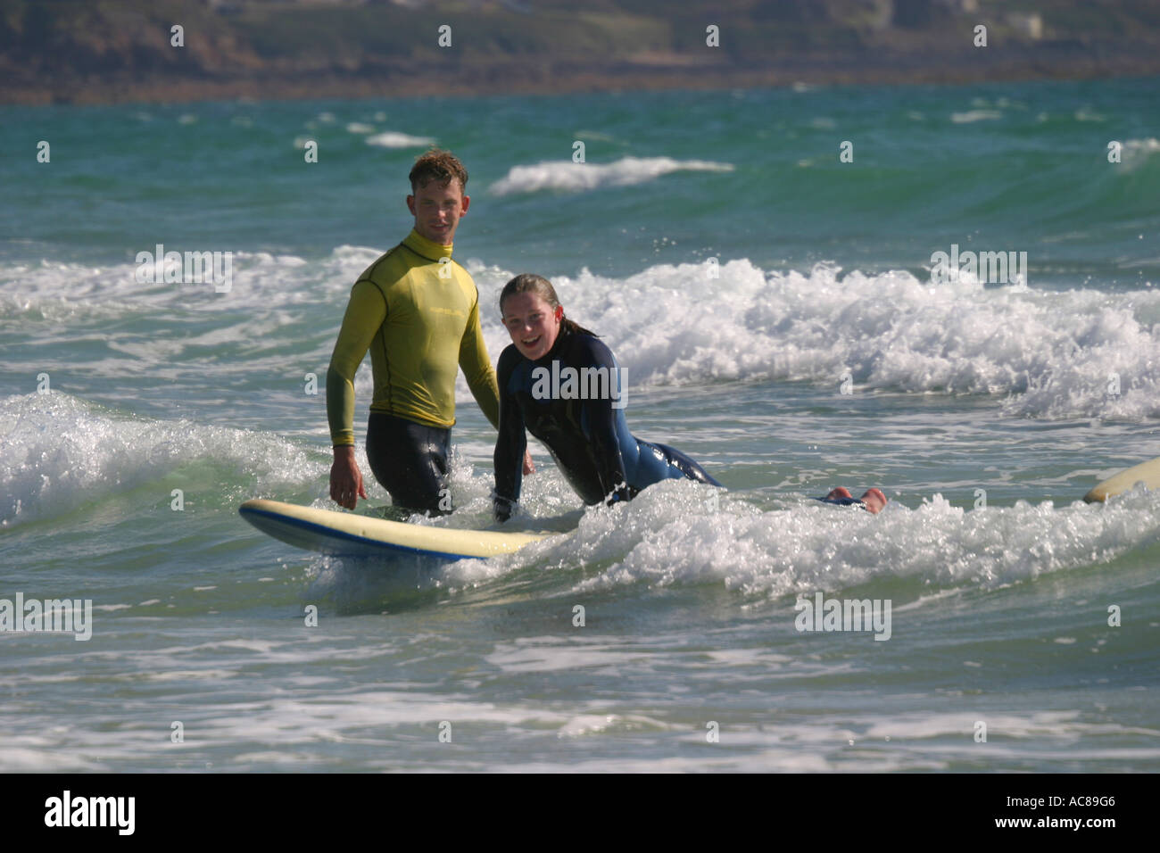 young teenage girl first surfing lesson on St Ouen's Beach Jersey Stock