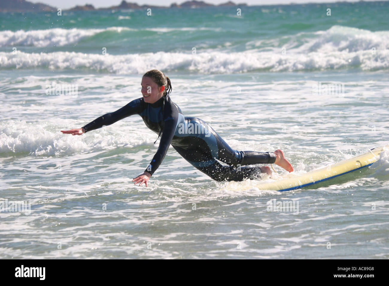teenage girl first surfing lesson on St Ouen's Beach Jersey Stock Photo