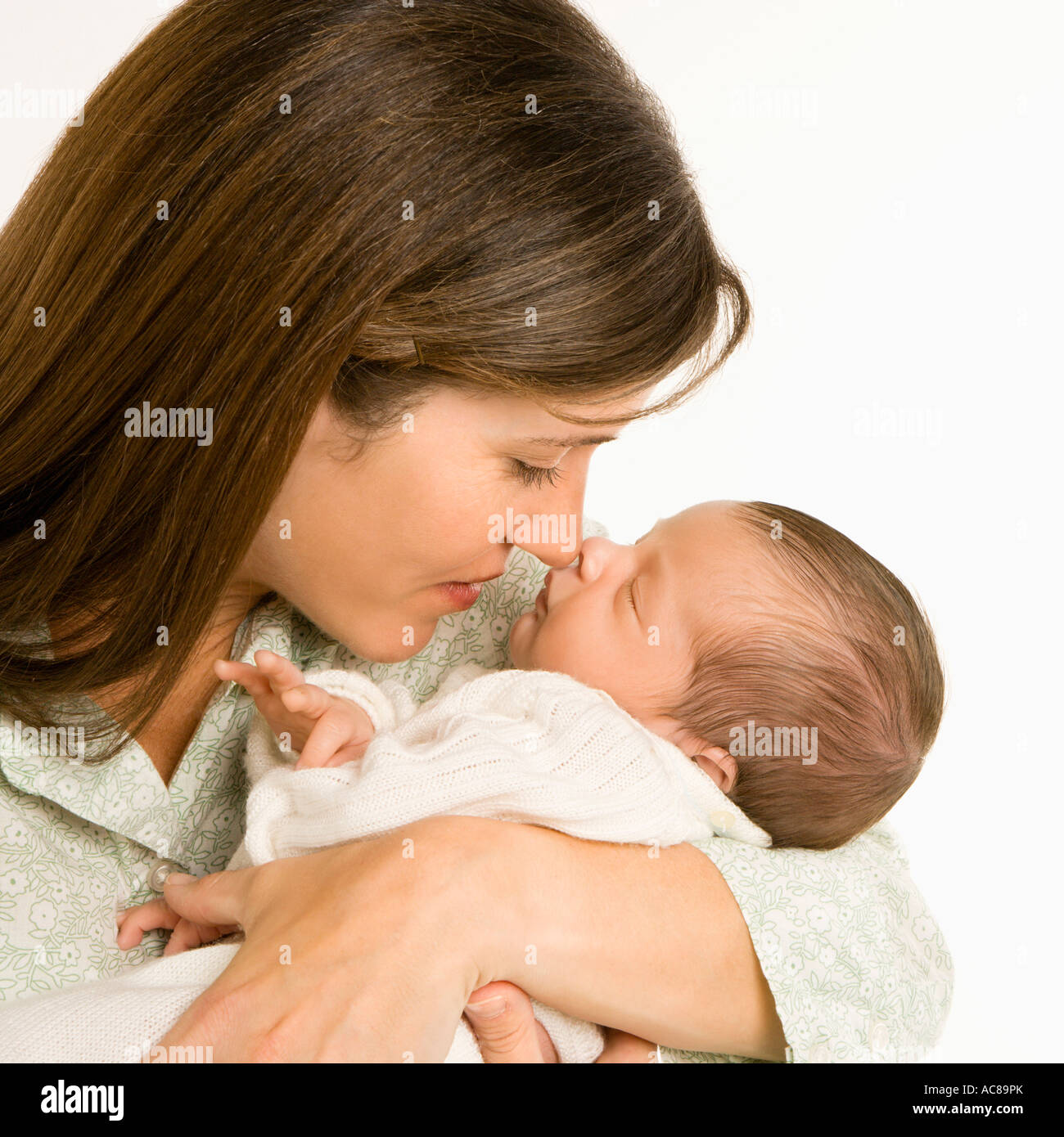 Mother nuzzling sleeping baby with nose and smiling Stock Photo Alamy