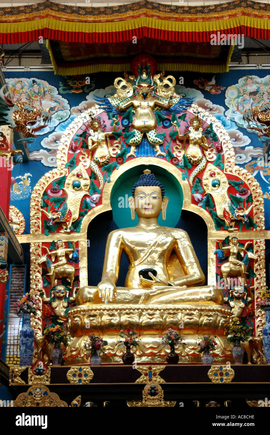 Golden Statue of Buddha in Golden Temple of Buddhist religion in Coorg in Karnataka in India Asia Stock Photo