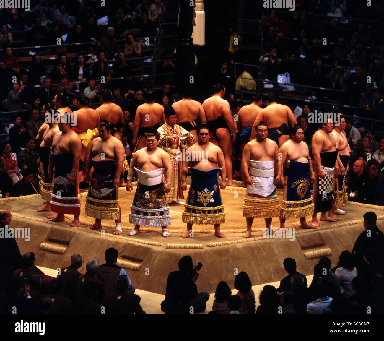 Sumo wrestlers at the Osaka Basho 2006 ring entering ceremony Stock