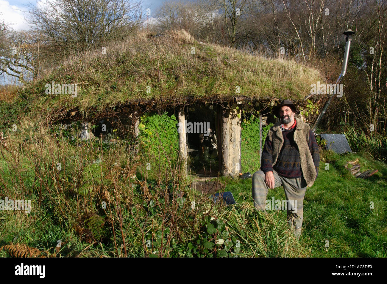 Tony Wrench with the eco home roundhouse he built without planning