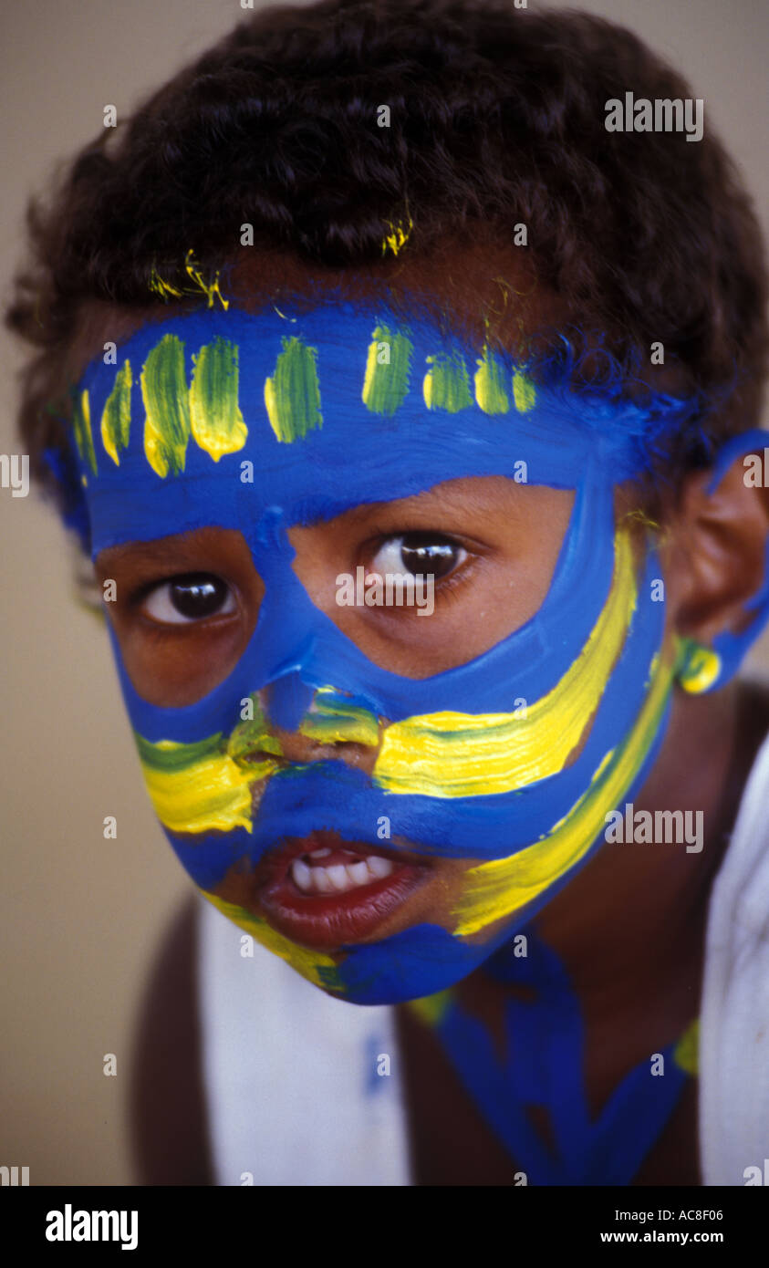 Aboriginal child with face paint blue yellow 1447 Stock Photo - Alamy
