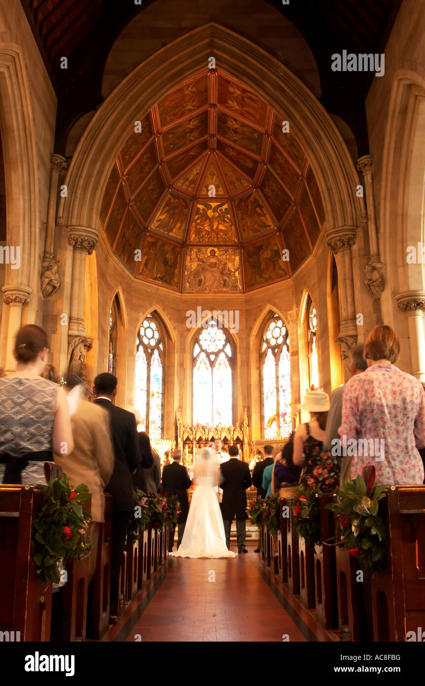 Bride and groom at the altar looking down the aisle Stock Photo - Alamy