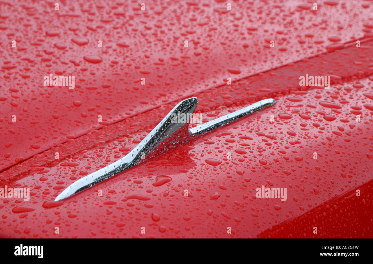 Silver chrome fin on red wing of 1959 Plymouth Sports Fury Stock Photo