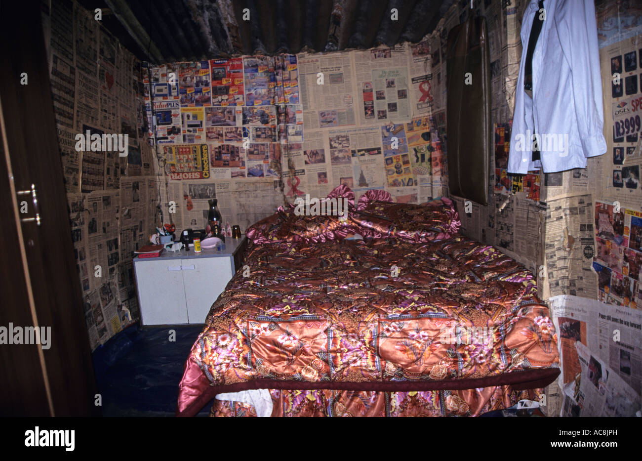 Bedroom inside shack, Golden's house, Khayelitsha Township, Cape Town, South Africa Stock Photo