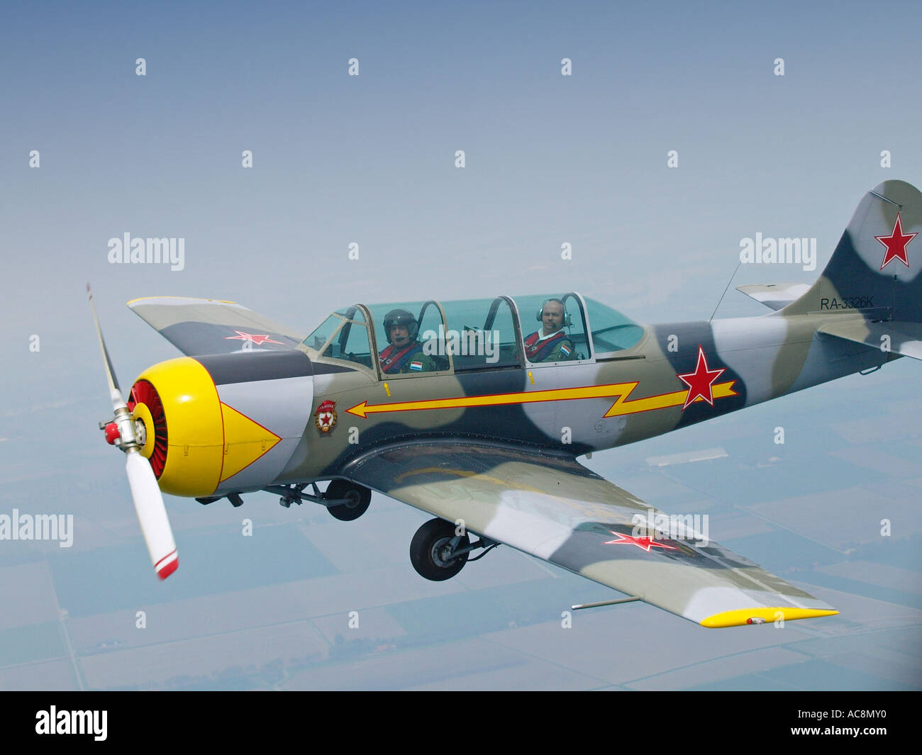 Yakovlev Yak 52 Russian two seater trainer aeroplane flying over Stock ...