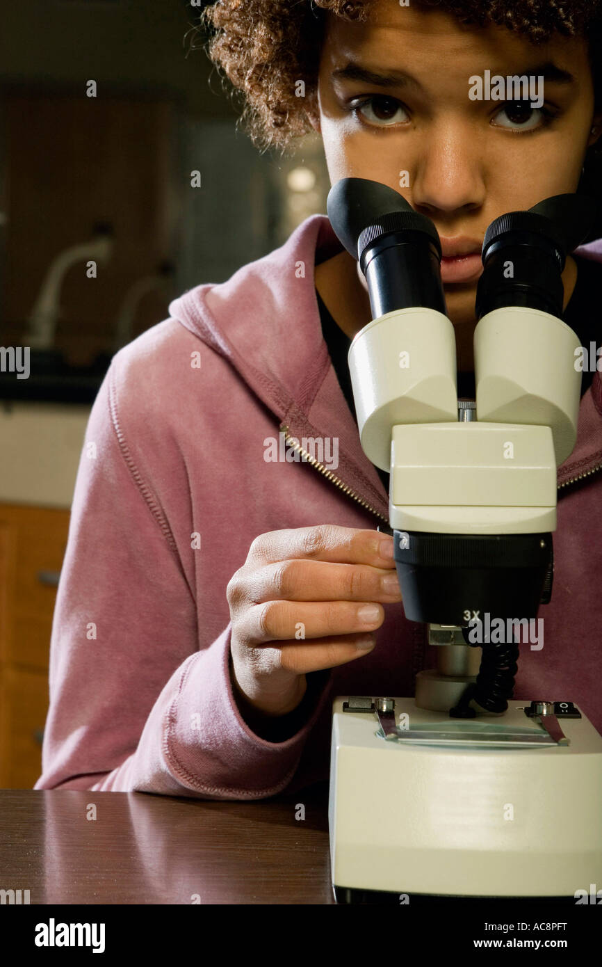 Portrait of a student with a microscope Stock Photo - Alamy
