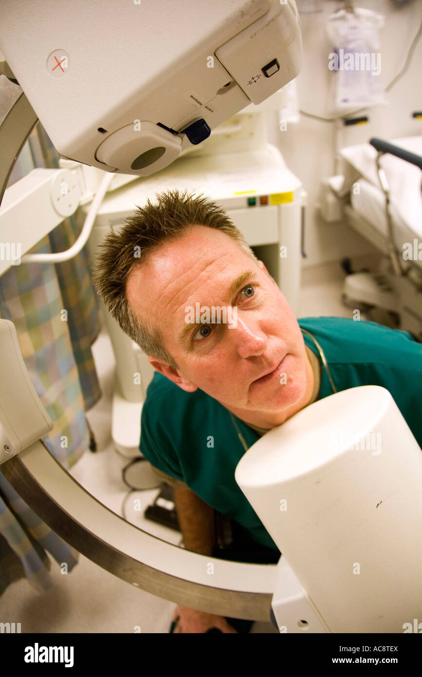 Male doctor looking at x-ray equipment Stock Photo