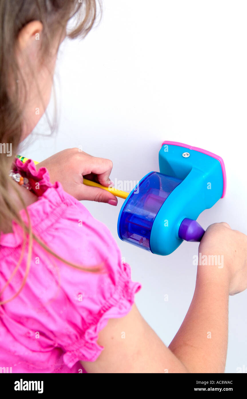 School girl sharpening pencil hi-res stock photography and images - Alamy