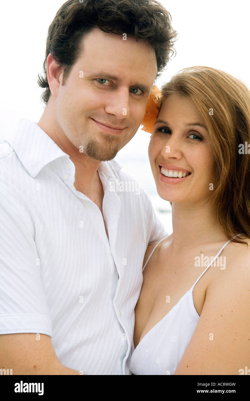 Portrait of a mid adult man embracing a young woman Stock Photo - Alamy
