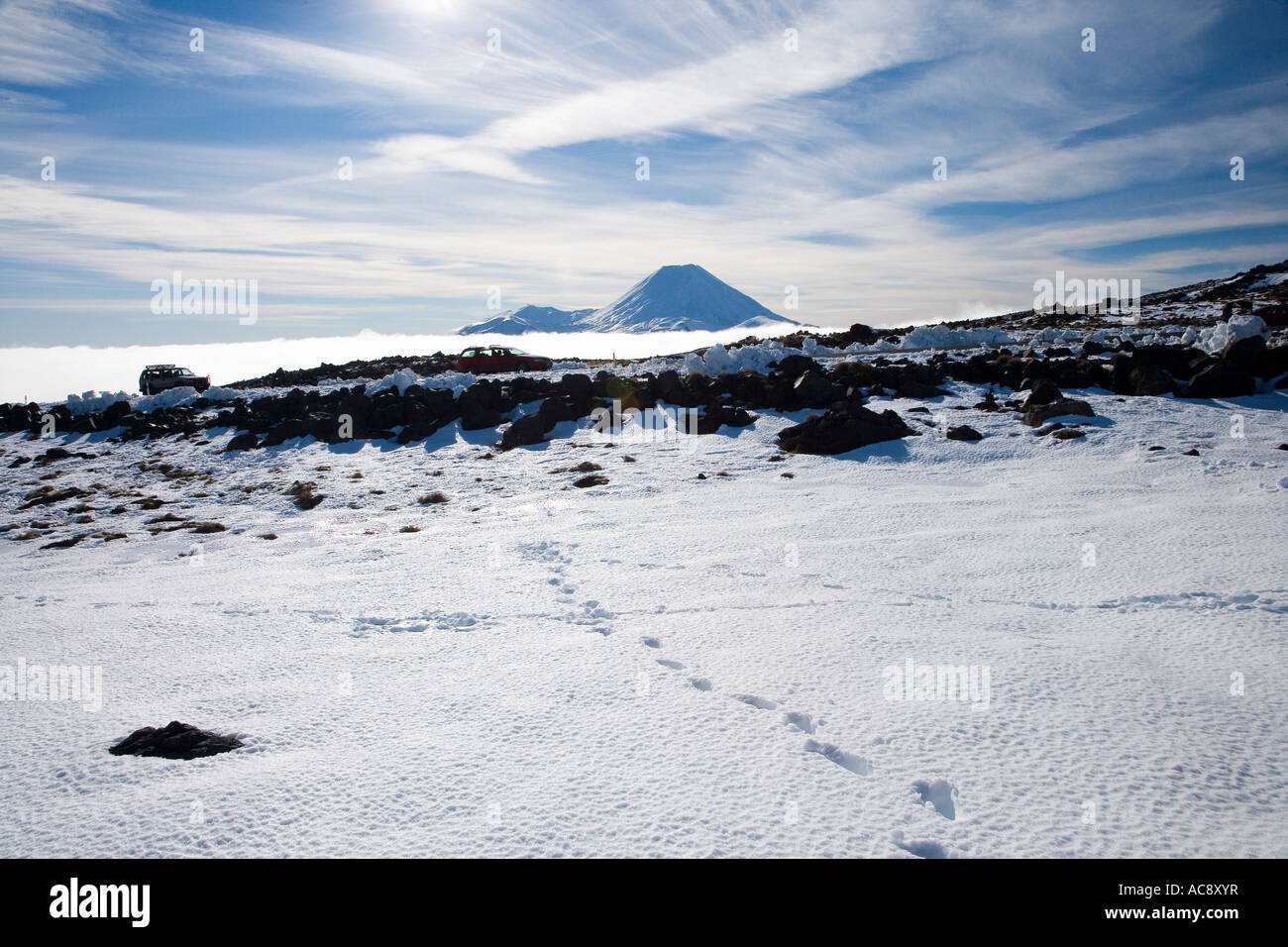 Footsteps in Snow and Mt Ngauruhoe Tongariro National Park Central Plateau North Island New Zealand Stock Photo