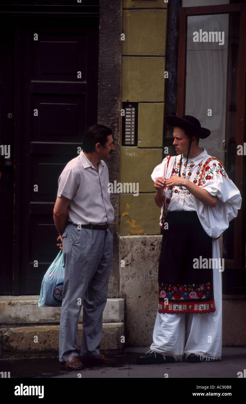 Budapest two men talking one in traditional Hungarian costume Stock Photo