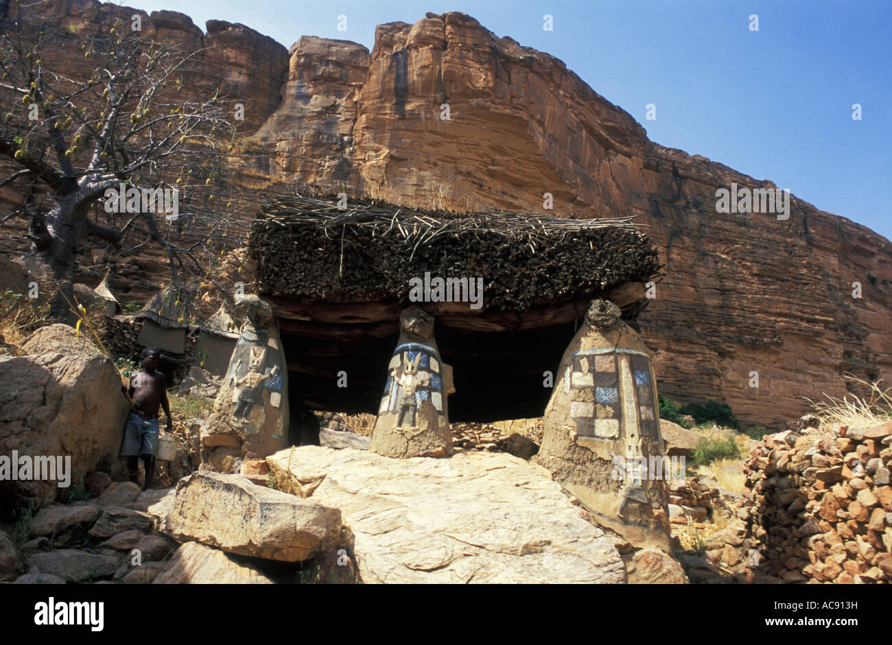 Cliffside shrine above Dogon village near Bandiagara escarpment, Dogon country Mali Stock Photo