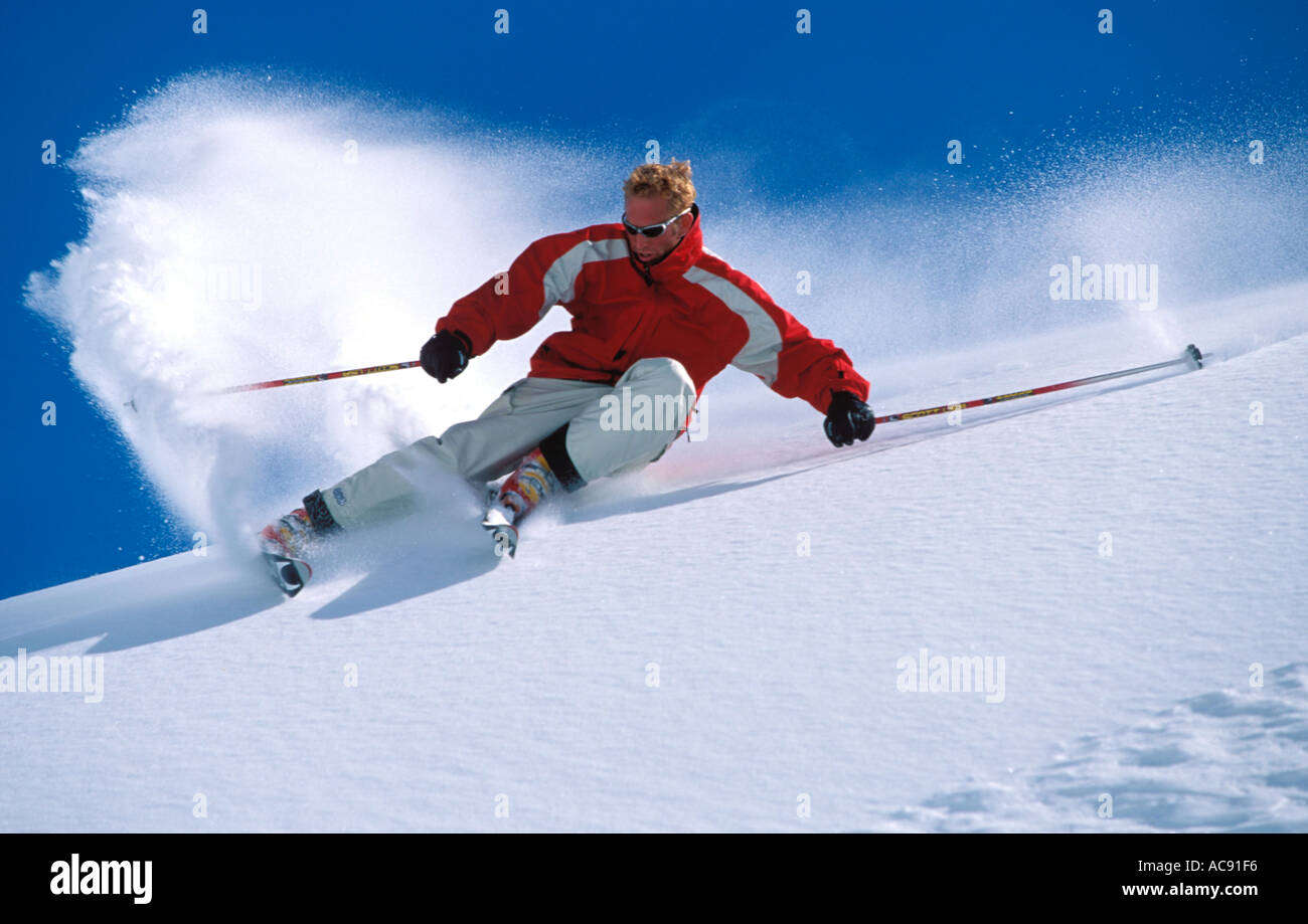 Extreme Skier Turning With The Snow Spraying Up Behind Him Stock Photo Alamy Extreme Skier Turning With The Snow Spraying Up Behind Him Stock Photo Alamy