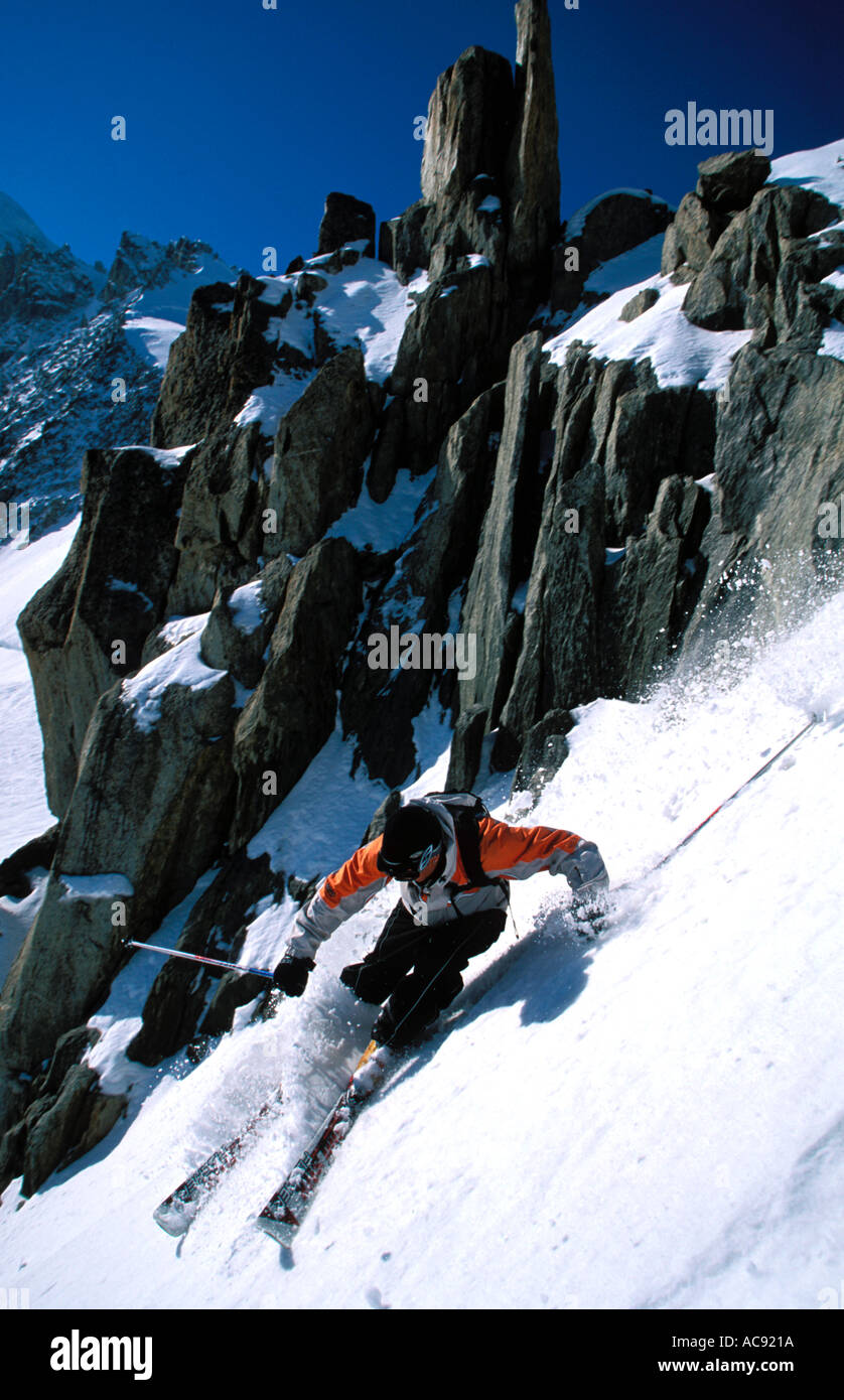Skiier attacking a steep slopes near Chamonix Stock Photo