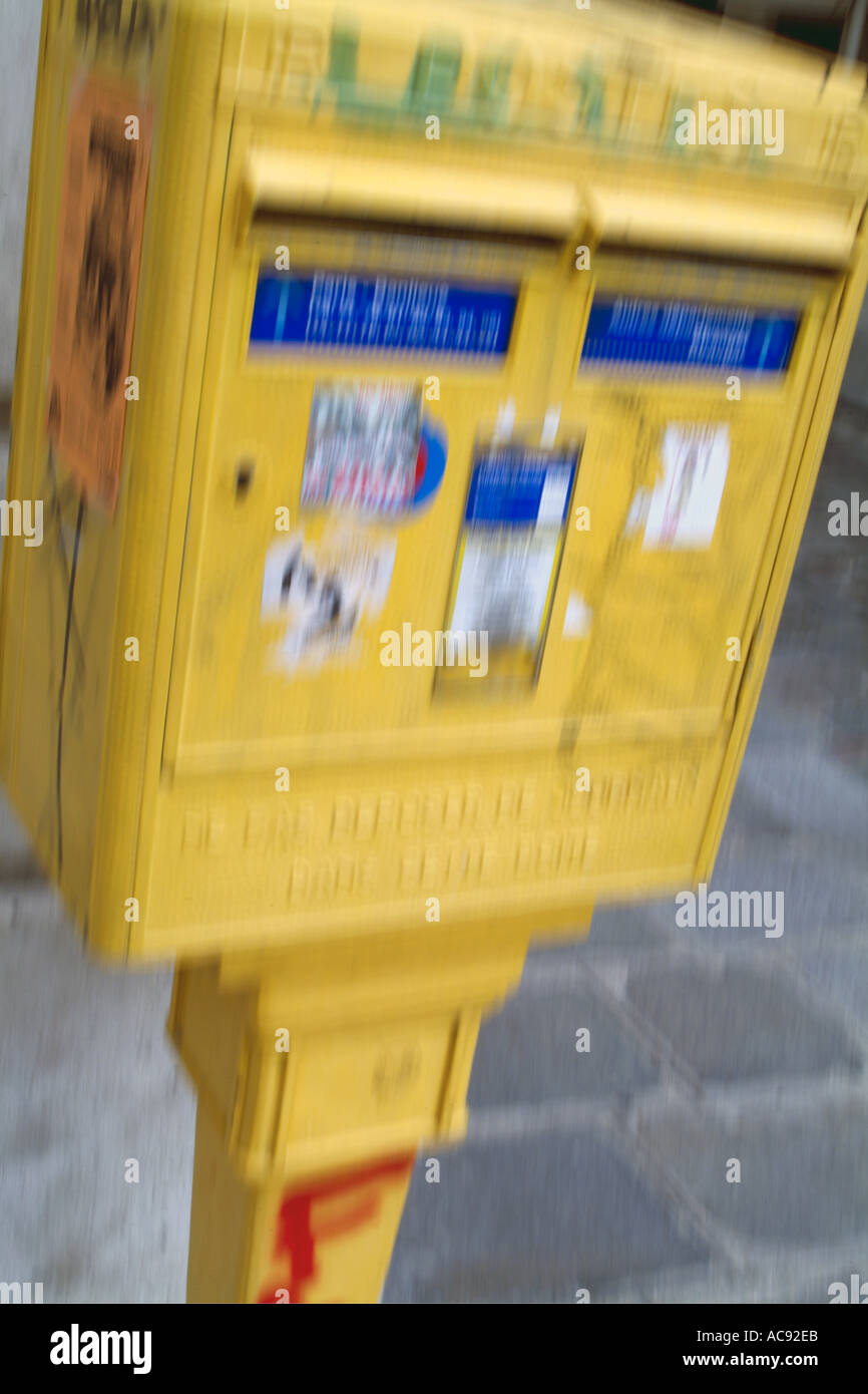 France paris blurred yellow public mailbox on a street Stock Photo