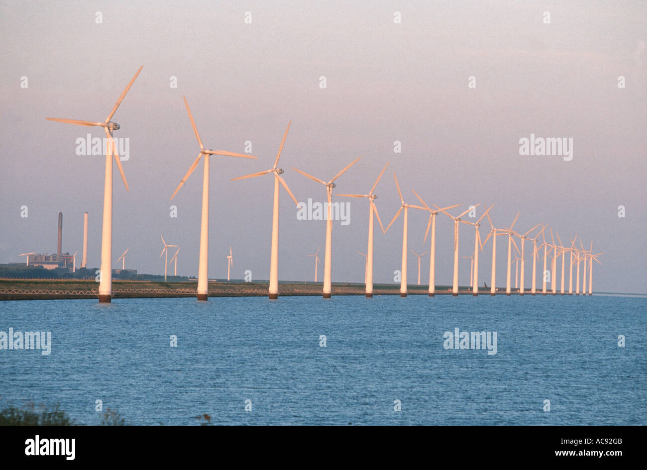 wind engines along the coast of  the ijsselmeer, Netherlands Stock Photo