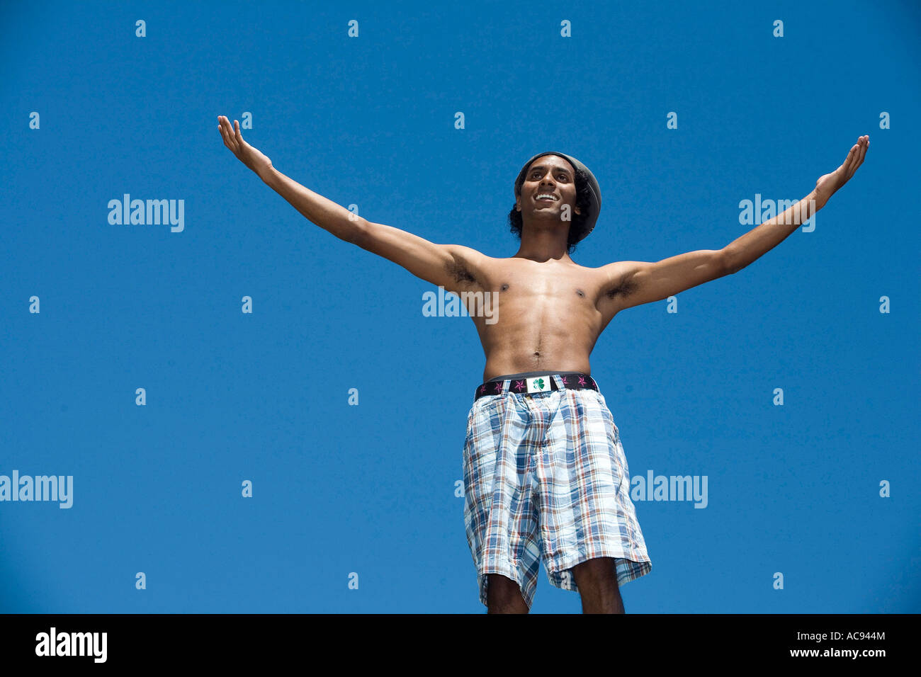 Low angle view of a young man gesturing Stock Photo