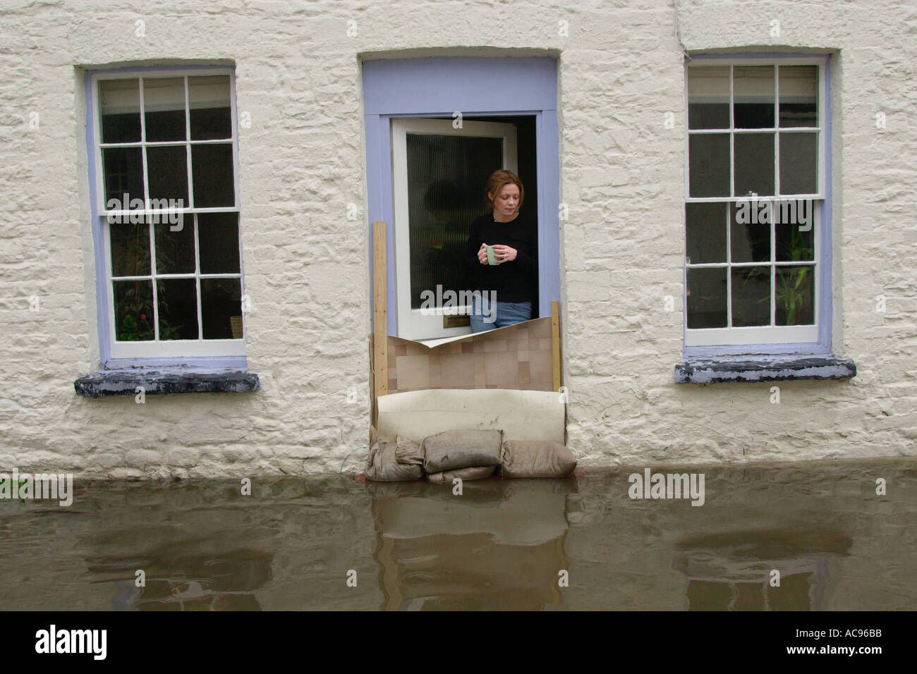Barricading a house in Crickhowell against rising floodwater after the River Usk burst its banks Powys Wales UK GB Stock Photo
