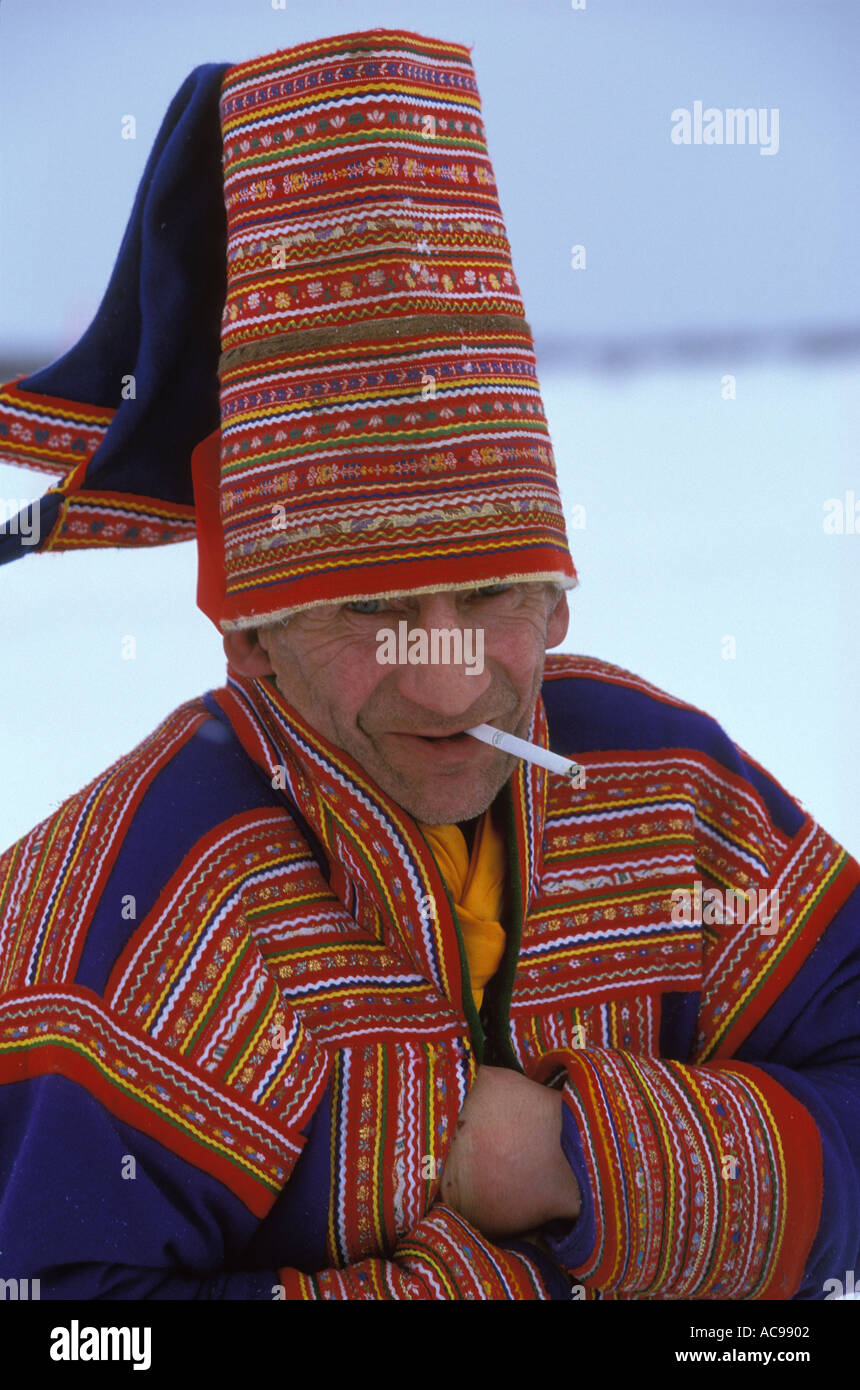 A Saami man in traditional costume smokes a cigarette, Kautokeino,  northern Norway. Stock Photo