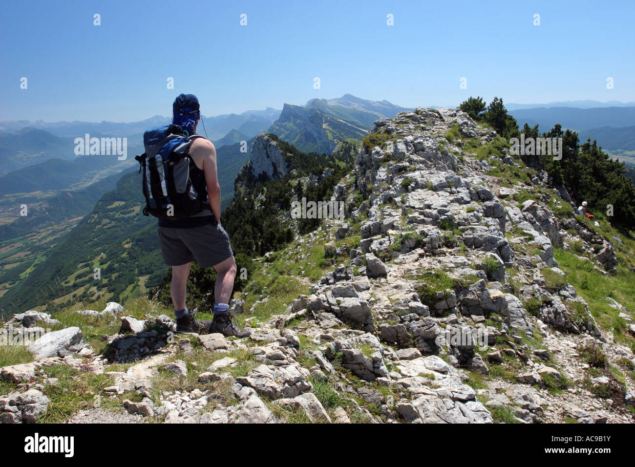 Mountaineer on the Summit of Le Moucherotte and the View South Vercors Regional Natural Park France Stock Photo