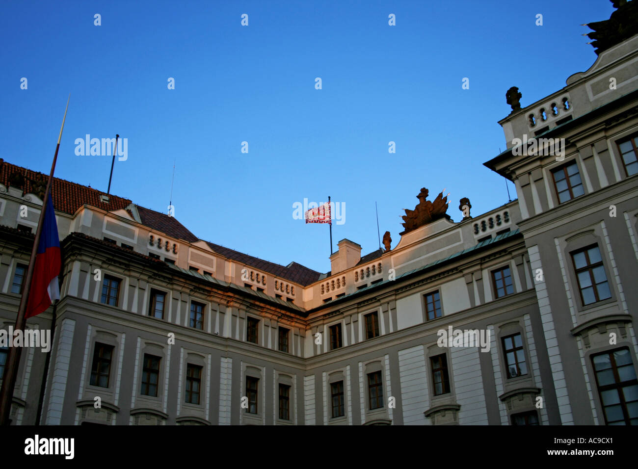 Historic architecture and national flag at dusk, Prague. Stock Photo