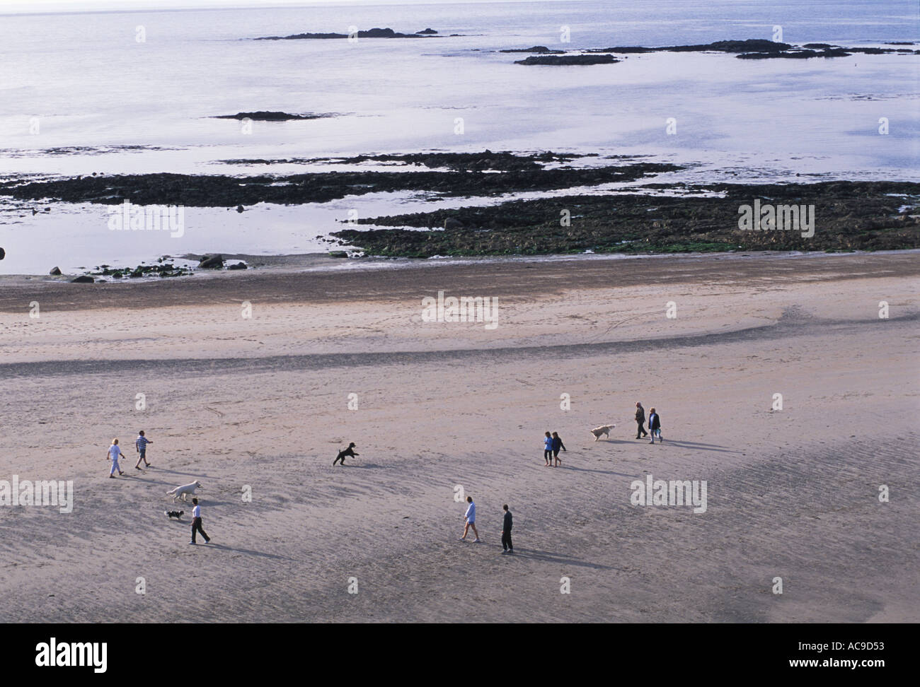 St Ouens Bay Jersey The Channel islands UK. Families walking on the beach 2000s HOMER SYKES Stock Photo