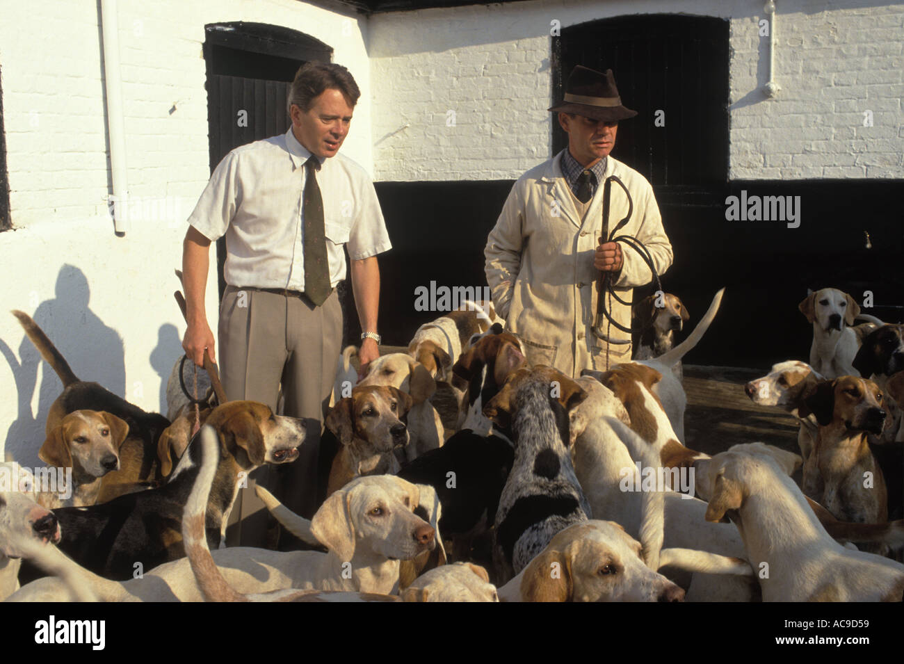 Foxhounds Kennel Wiltshire 1990s UK Professional kennelmen about to