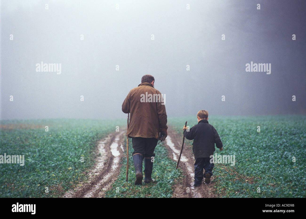 Father and son walking in the countryside together quality time. Hampshire England 2000s HOMER SYKES Stock Photo
