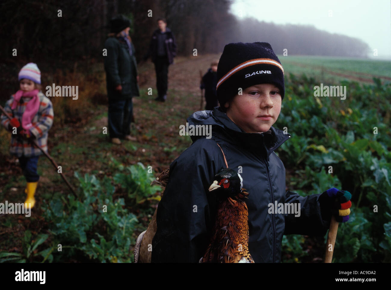 Children rural sport kids at a Game Bird pheasant shoot Hampshire England Teenager getting instruction  working as beaters 2000s HOMER SYKES Stock Photo