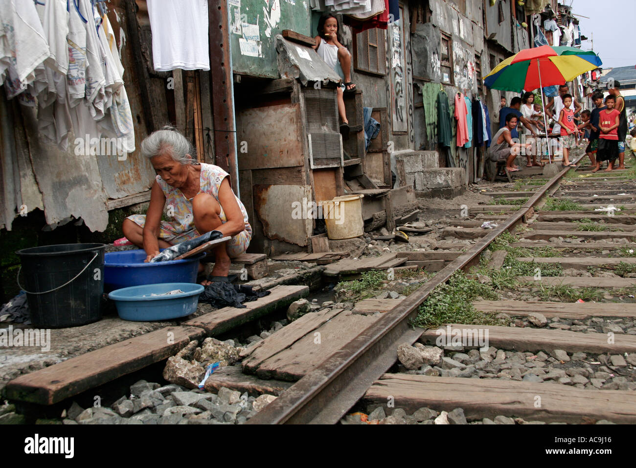 Laundry by the railway tracks in Manila slums Stock Photo 4271637 Alamy