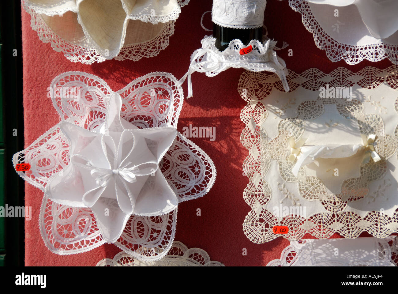 Lace for sale Burano a small beautiful island close to Venice Italy Famous  for lace making and brightly painted houses Stock Photo - Alamy