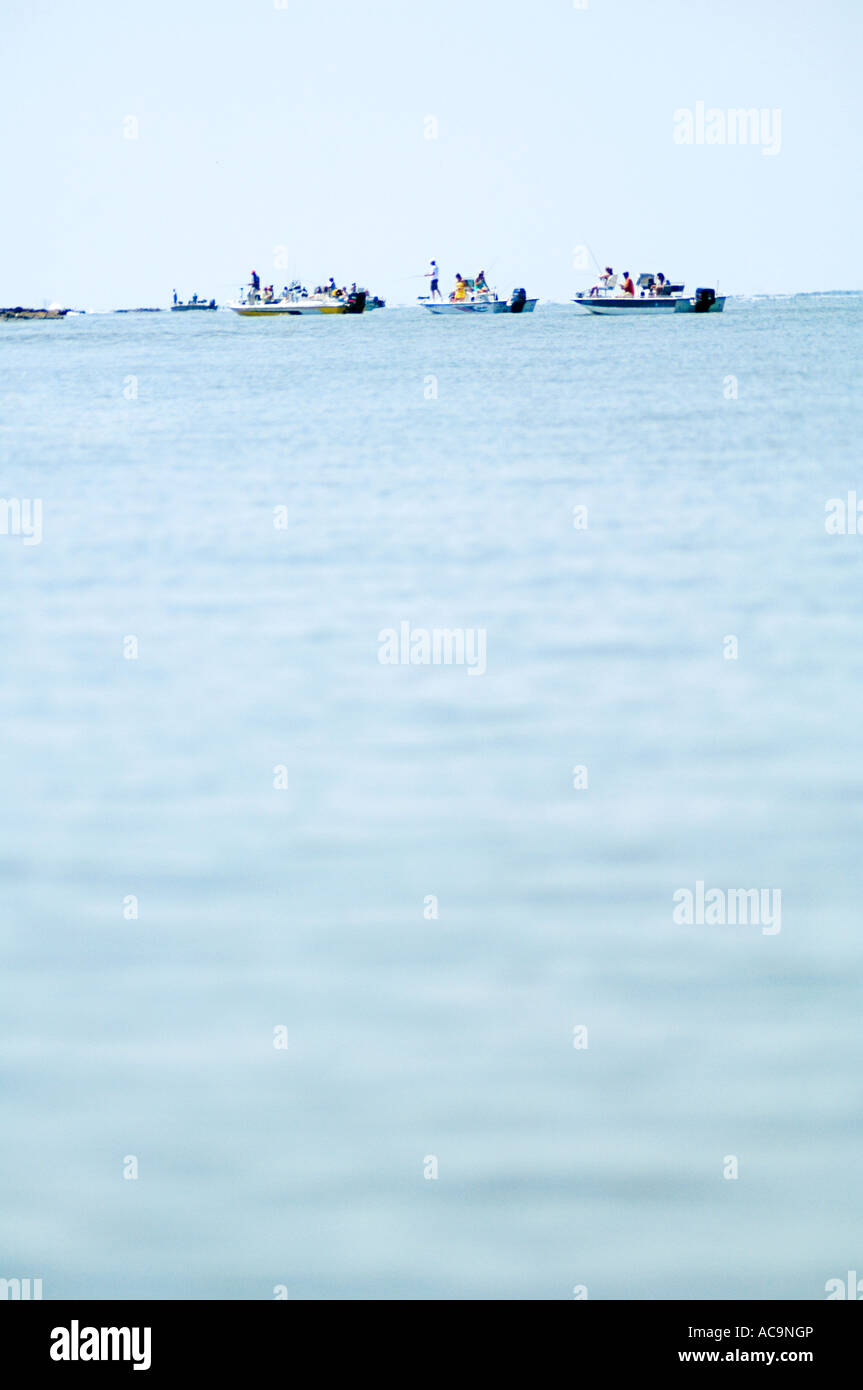 Sportsmen fish the Upper Gulf Coast at the Sabine Pass Getties near Pt. Arthur TX. Stock Photo