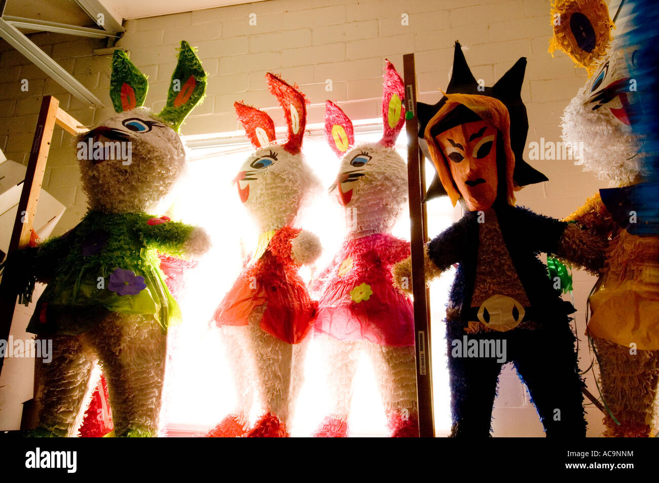 Bunny Shaped Pinatas Backlit in Window Stock Photo