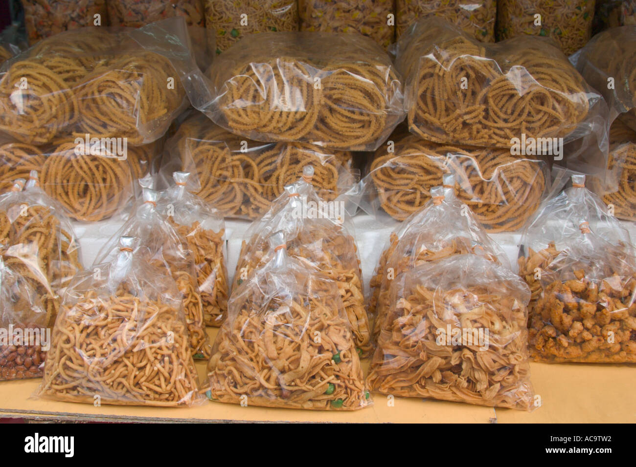 packets of indian crunchy snacks on sale Stock Photo Alamy