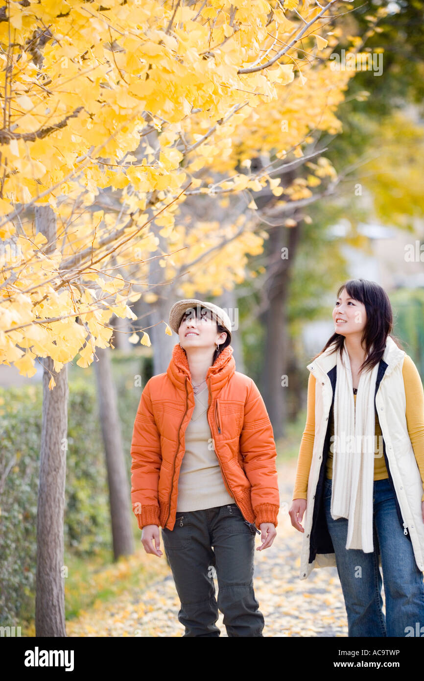 Two young women walking Stock Photo - Alamy