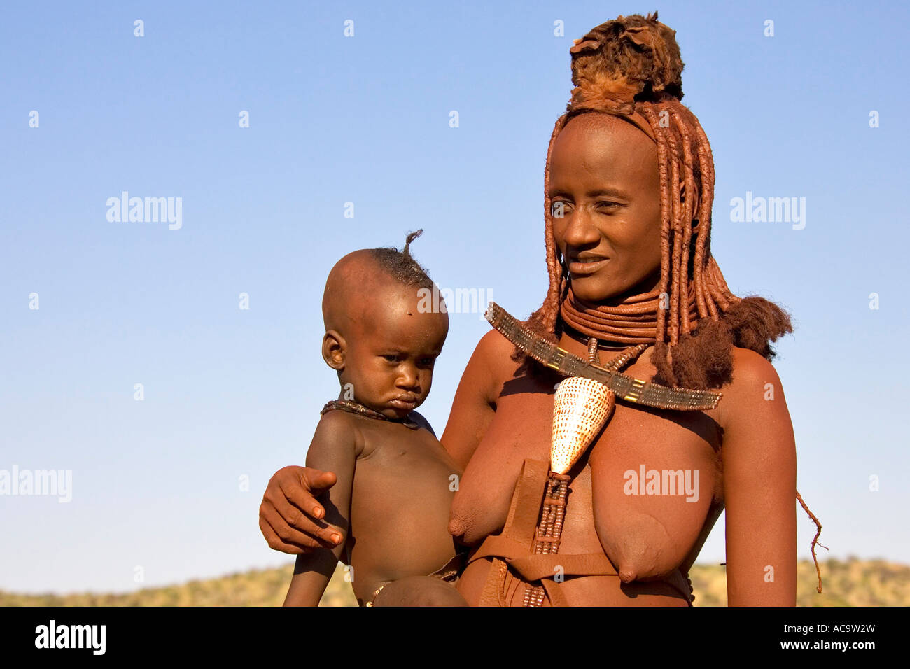 Himbawoman with baby, Kaokoveld, Namibia, Africa Stock Photo
