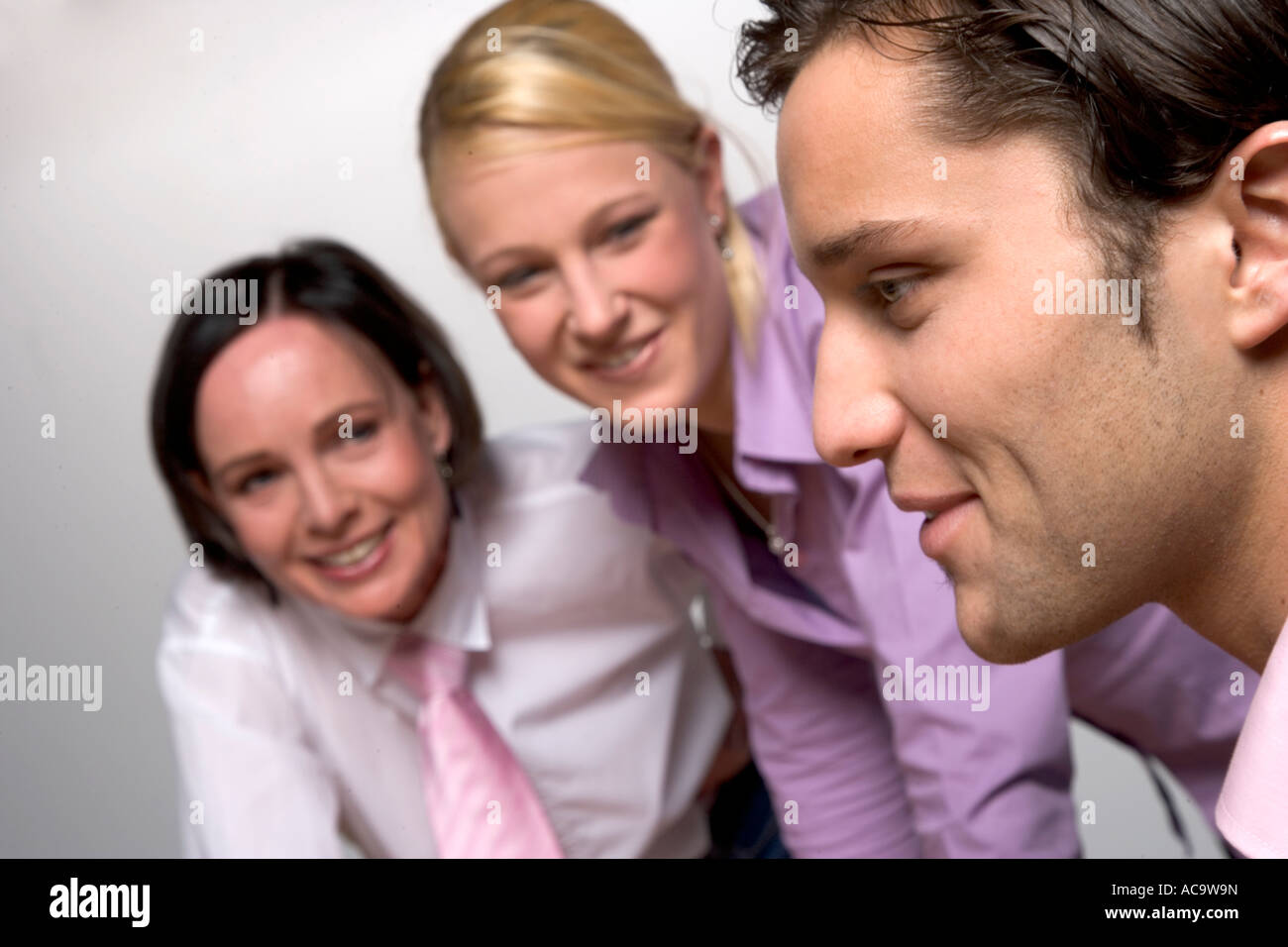 Young businessmann and women discussing Stock Photo