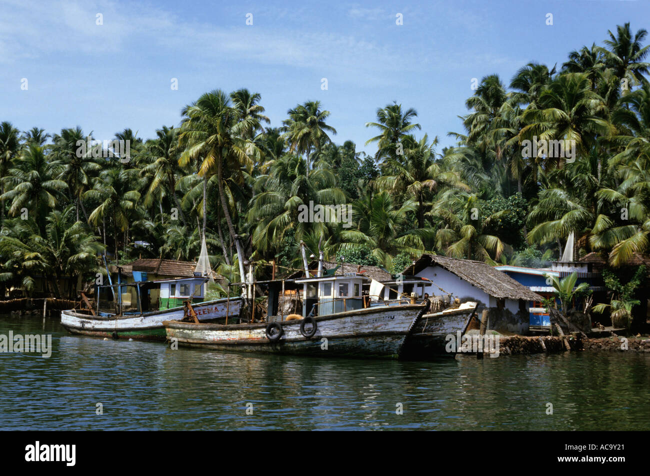 Fishing boats docked at a village wharf, Kerala, India. Stock Photo