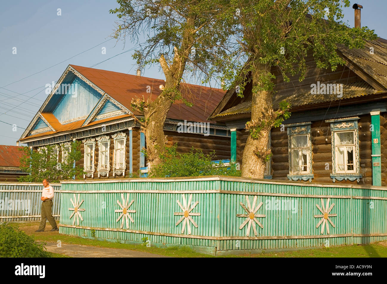 Typical Russian wooden house with garden fence, village Lomovka, russia