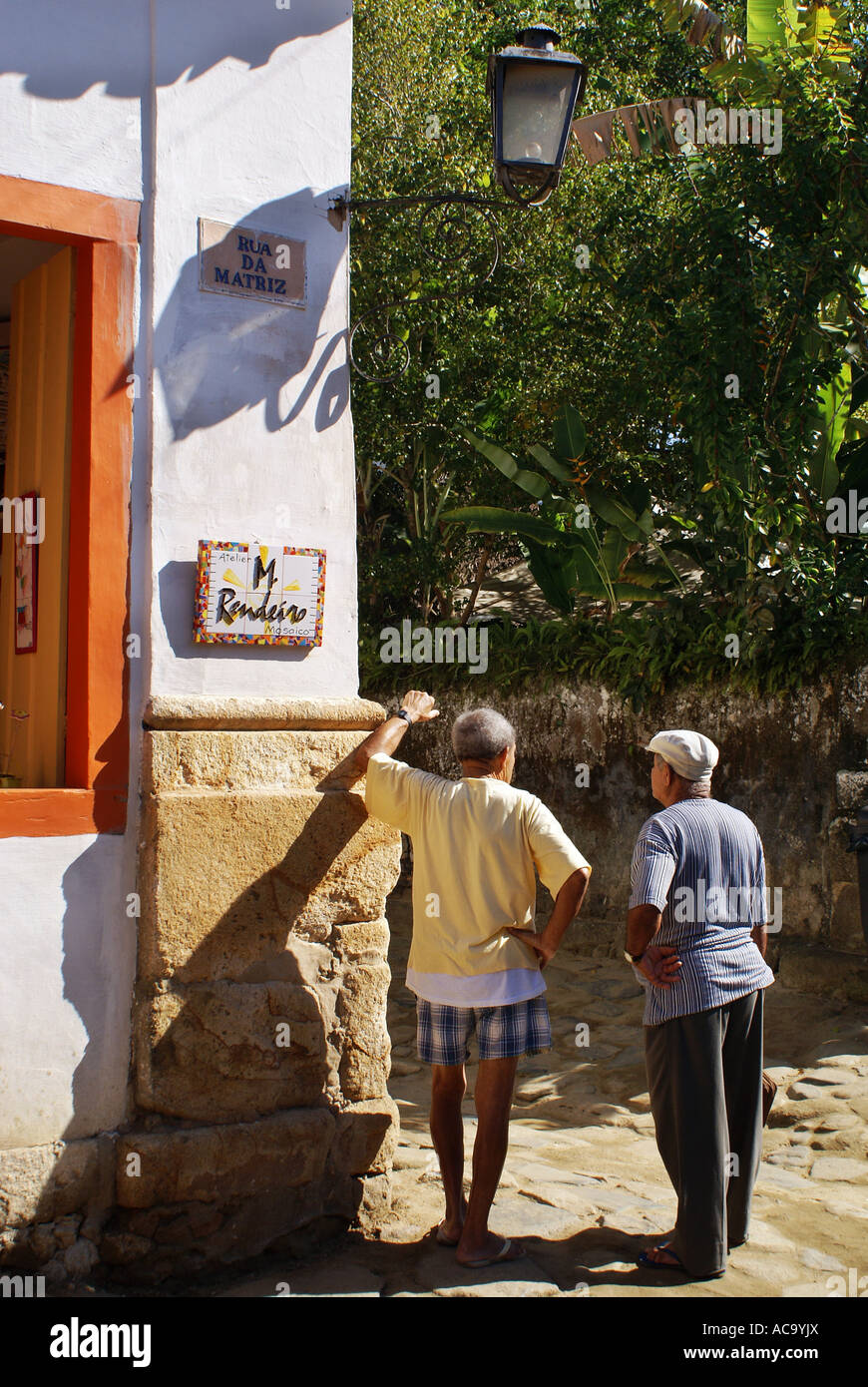 Old men chatting, Paraty, Brazil Stock Photo
