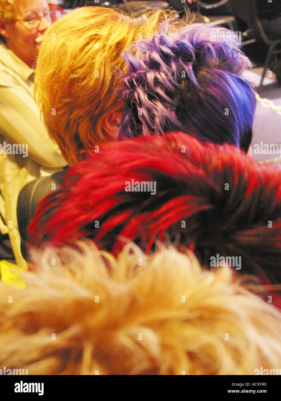 Three Ladies With Various Hair Colors Seen From Behind Orange