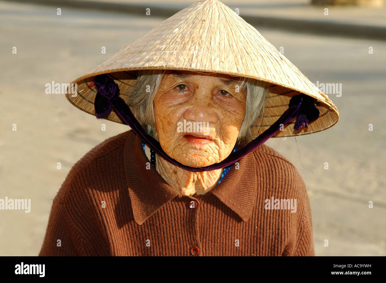 Portrait of an old woman in Hoi An, Vietnam Stock Photo