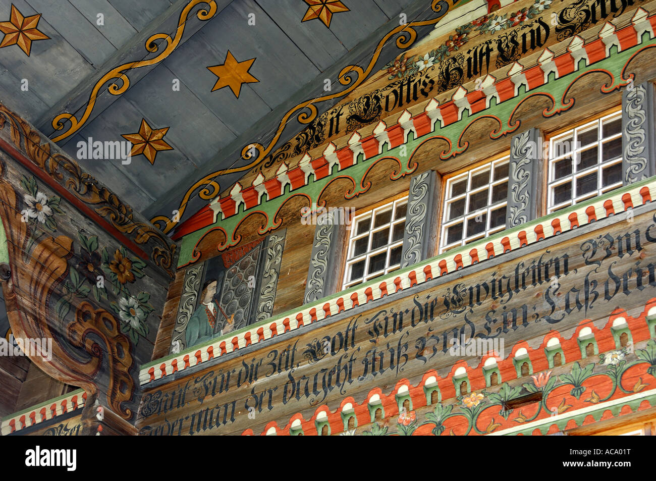 Painted traditional Swiss chalet, painting of house builder, Daerstetten, Simmental, Switzerland Stock Photo