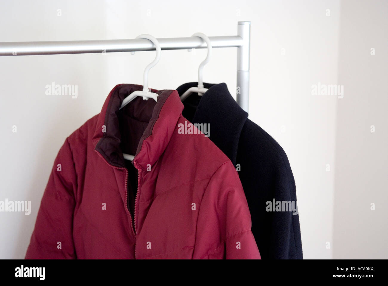 Jackets hanging on coat hanger Stock Photo
