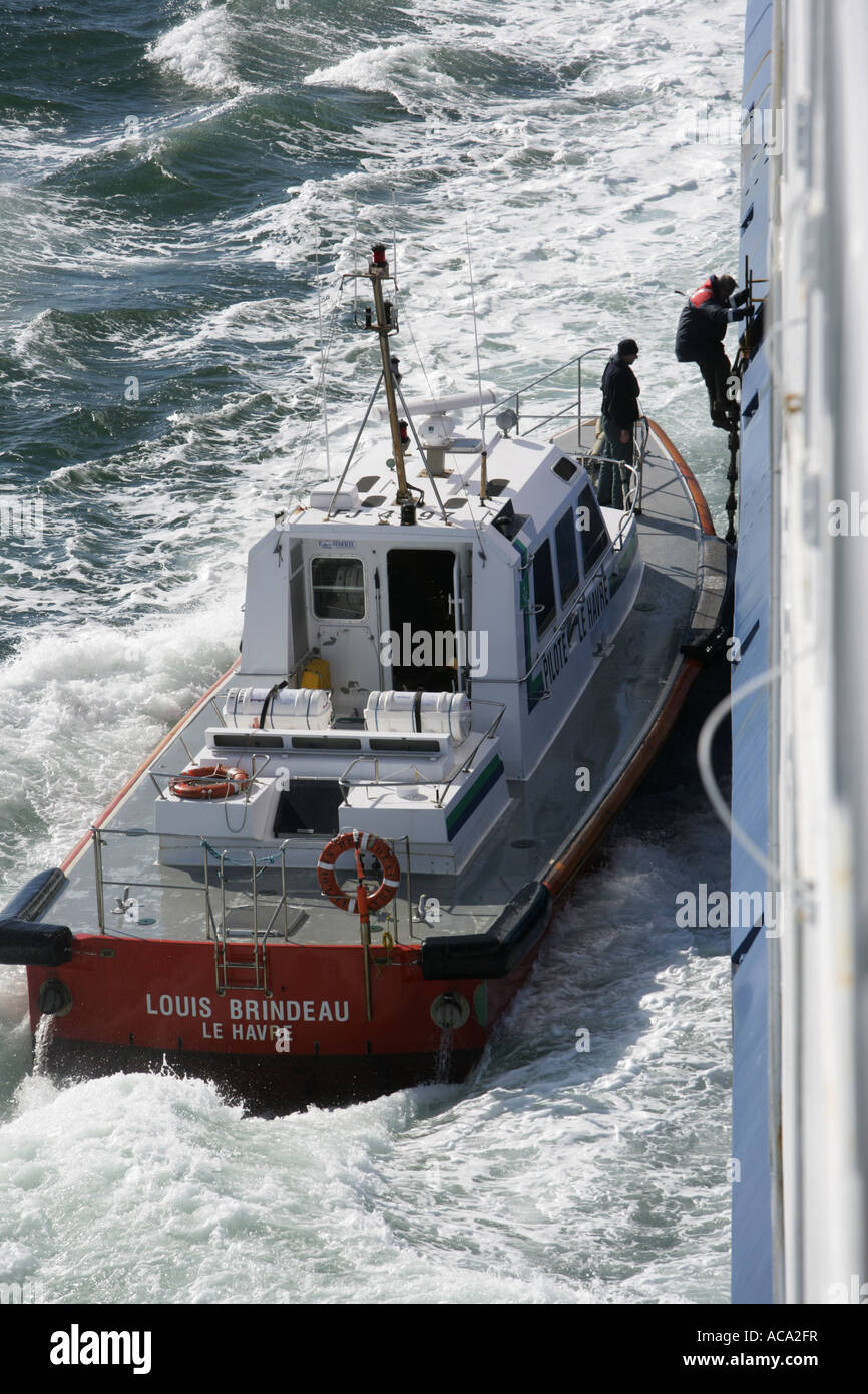 Pilot boat in the harbour is boarding a ship pilot, Le Havre, France
