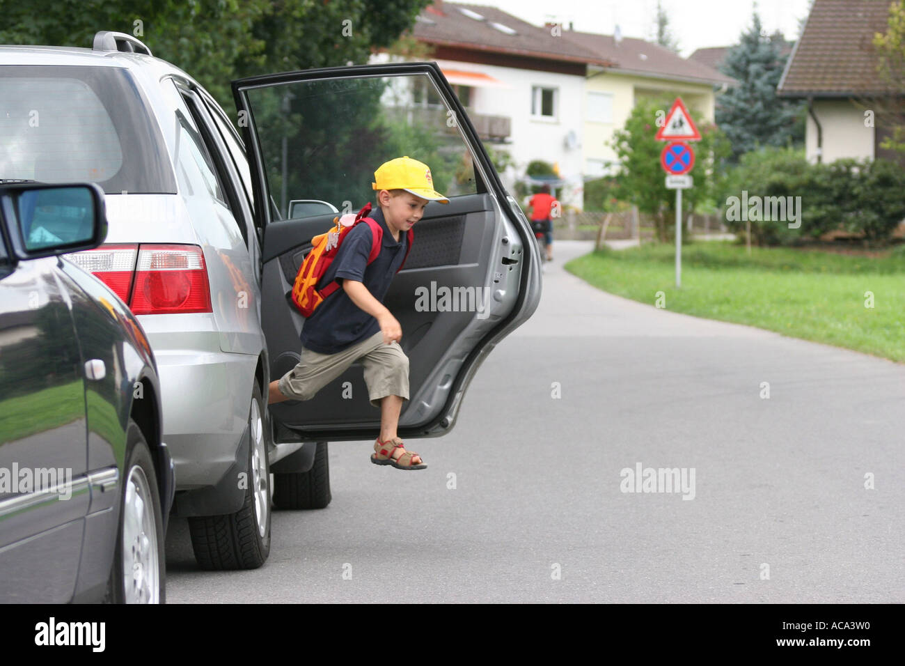 Child jumps out of a car Stock Photo Alamy